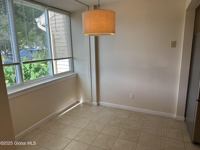 11 Derby Dr, Saratoga Springs, NY 12866 - empty room featuring light tile patterned floors and baseboards