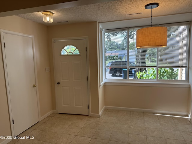 11 Derby Dr, Saratoga Springs, NY 12866 - foyer with a textured ceiling and light tile patterned flooring