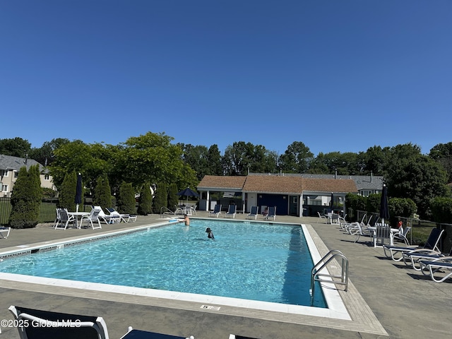 11 Derby Dr, Saratoga Springs, NY 12866 - community pool with a patio and view of wooded area
