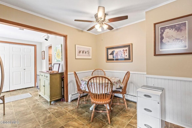 236 Cherry St, Schenectady, NY 12306 - dining area featuring ceiling fan, a wainscoted wall, crown molding, and baseboard heating