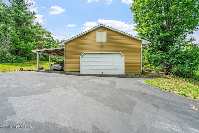 1927 Berne Altamont Rd, Altamont, NY 12009 - garage featuring a garage and asphalt driveway