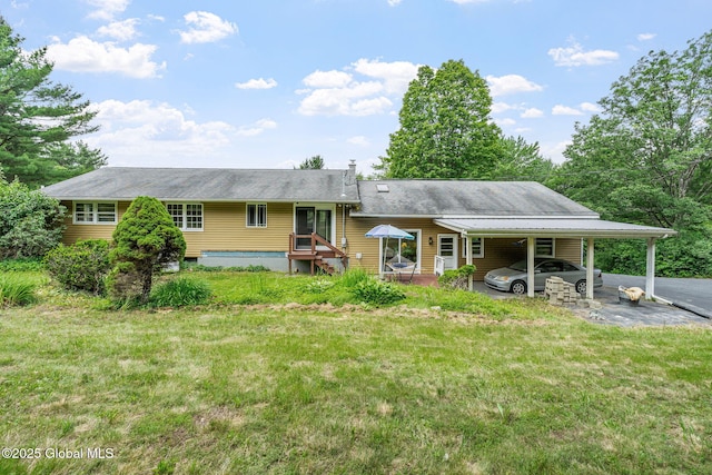 1927 Berne Altamont Rd, Altamont, NY 12009 - rear view of property with an attached carport and a lawn