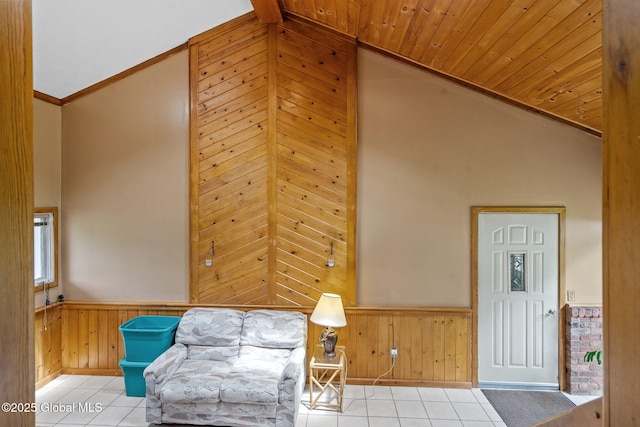 1927 Berne Altamont Rd, Altamont, NY 12009 - living area with a wainscoted wall, tile patterned floors, wood walls, ornamental molding, and high vaulted ceiling