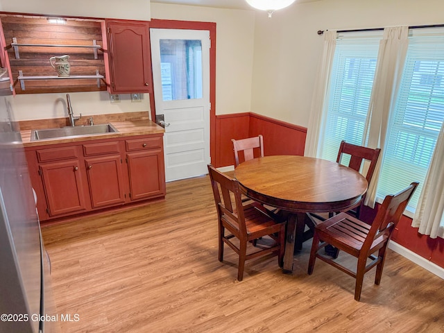 4882 Potter Hollow Rd, Rensselaerville, NY 12469 - dining space with wainscoting and light wood finished floors