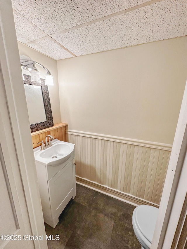 4882 Potter Hollow Rd, Rensselaerville, NY 12469 - bathroom featuring wainscoting, vanity, and a paneled ceiling