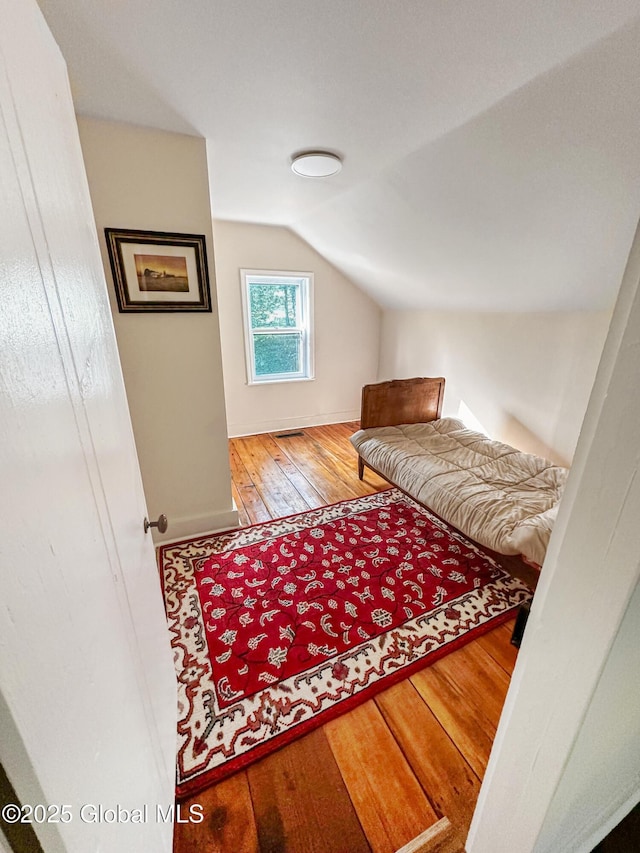 4882 Potter Hollow Rd, Rensselaerville, NY 12469 - bedroom with vaulted ceiling and hardwood / wood-style floors