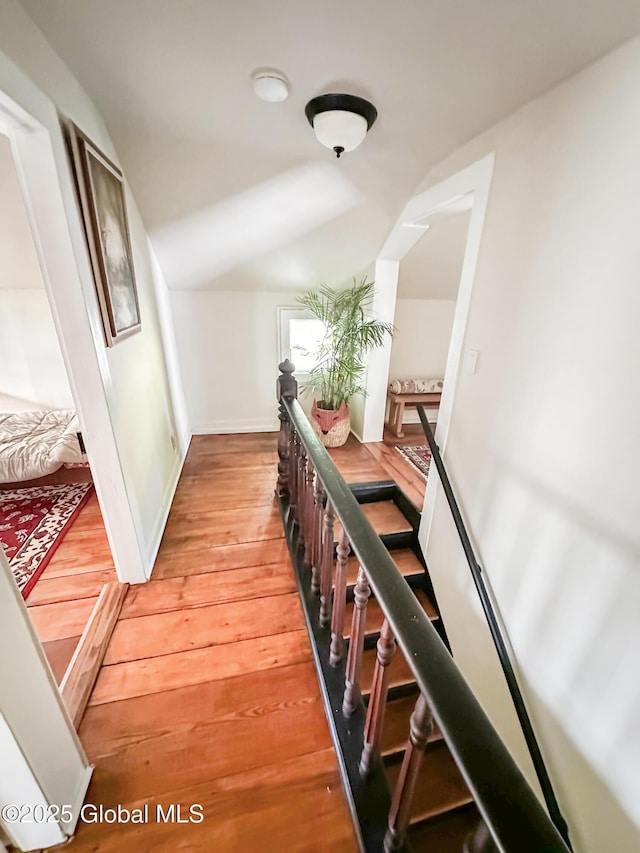 4882 Potter Hollow Rd, Rensselaerville, NY 12469 - hallway with lofted ceiling, light wood finished floors, and an upstairs landing