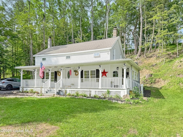 4882 Potter Hollow Rd, Rensselaerville, NY 12469 - farmhouse featuring covered porch, a chimney, a front lawn, and a shingled roof