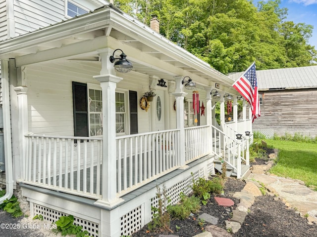 4882 Potter Hollow Rd, Rensselaerville, NY 12469 - view of side of home featuring covered porch and a chimney