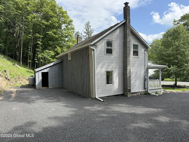 4882 Potter Hollow Rd, Rensselaerville, NY 12469 - view of side of property with a chimney