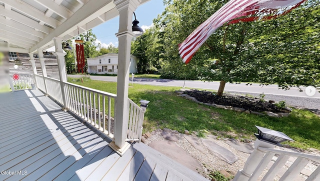 4882 Potter Hollow Rd, Rensselaerville, NY 12469 - wooden porch featuring a lawn