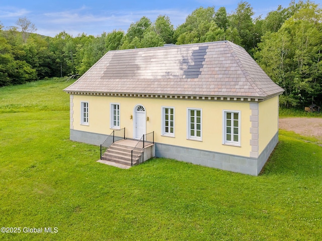 410 Jones Hill Rd, Jefferson, NY 12093 - view of front of home with a front yard and a forest view