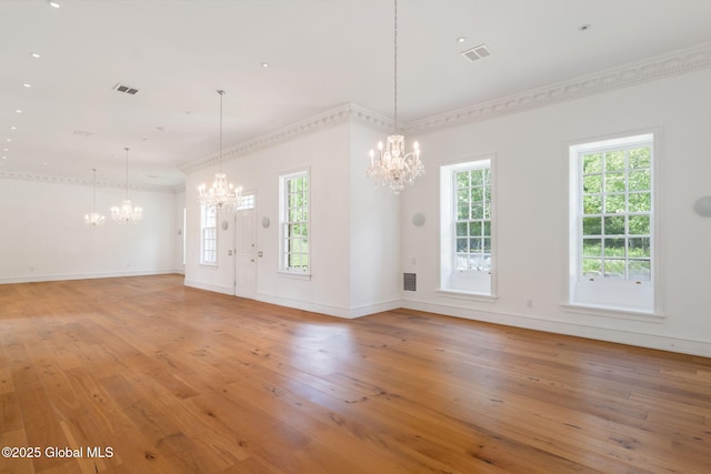 410 Jones Hill Rd, Jefferson, NY 12093 - unfurnished living room featuring a chandelier, light wood-style flooring, and ornamental molding