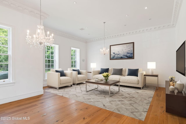 410 Jones Hill Rd, Jefferson, NY 12093 - living area with a chandelier, hardwood / wood-style floors, plenty of natural light, and ornamental molding
