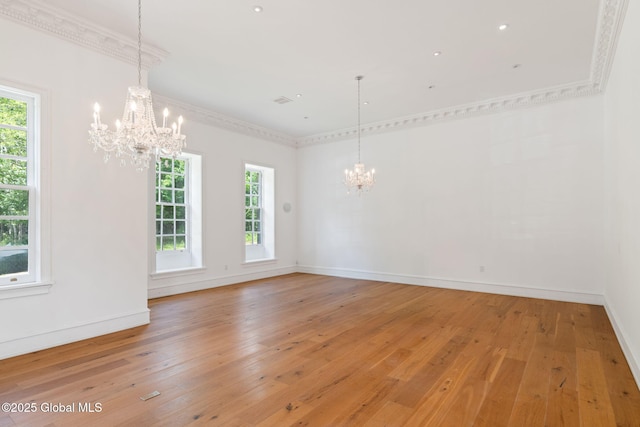 410 Jones Hill Rd, Jefferson, NY 12093 - spare room with a chandelier, plenty of natural light, light wood-style floors, and ornamental molding