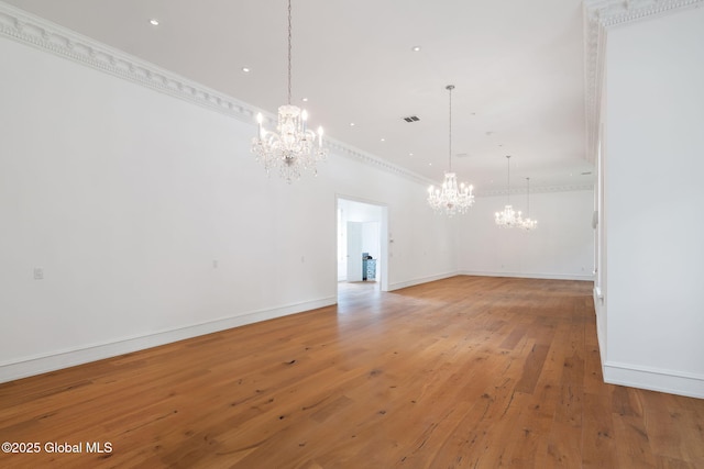 410 Jones Hill Rd, Jefferson, NY 12093 - unfurnished living room with a chandelier, light wood-type flooring, crown molding, and recessed lighting