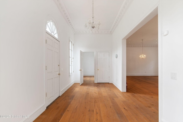 410 Jones Hill Rd, Jefferson, NY 12093 - foyer with a chandelier, light wood finished floors, a high ceiling, and ornamental molding