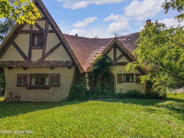 372 Jones Hill Rd, Jefferson, NY 12093 - view of front of home with stucco siding, a front lawn, and roof with shingles