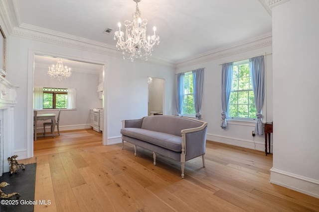 372 Jones Hill Rd, Jefferson, NY 12093 - living area with a chandelier, light wood-style flooring, and crown molding