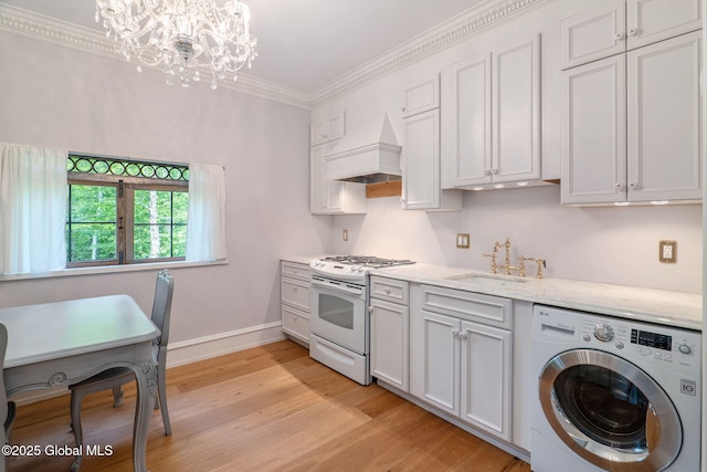 372 Jones Hill Rd, Jefferson, NY 12093 - kitchen featuring washer / clothes dryer, white gas range, custom exhaust hood, a chandelier, and light wood finished floors