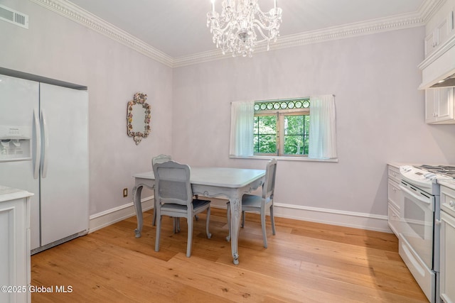372 Jones Hill Rd, Jefferson, NY 12093 - dining area featuring a chandelier, light wood-style flooring, and ornamental molding