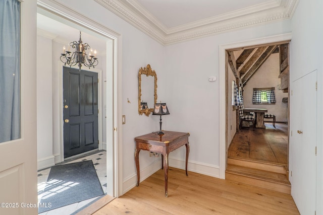372 Jones Hill Rd, Jefferson, NY 12093 - foyer featuring crown molding, a chandelier, and light wood finished floors