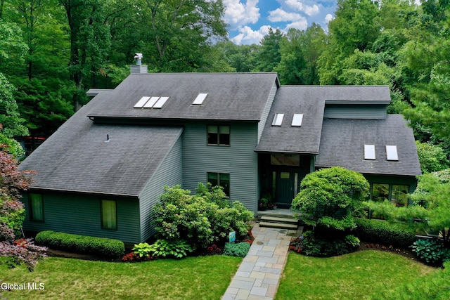 14 Friar Tuck Ct, Clifton Park, NY 12065 - view of front facade with a chimney, a front lawn, and a shingled roof