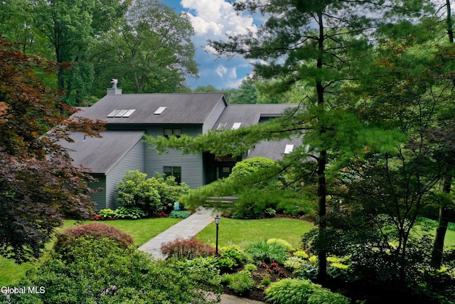 14 Friar Tuck Ct, Clifton Park, NY 12065 - view of front of property with a chimney, roof with shingles, and a front yard