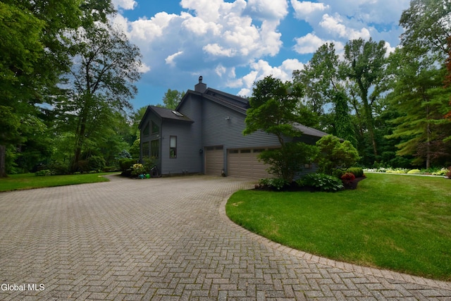 14 Friar Tuck Ct, Clifton Park, NY 12065 - view of side of property with driveway, a yard, a chimney, and a garage