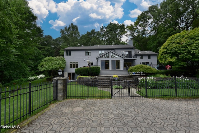 14 Friar Tuck Ct, Clifton Park, NY 12065 - view of front of home with a fenced front yard, a chimney, and a balcony