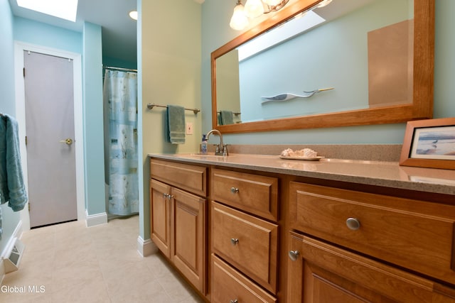 14 Friar Tuck Ct, Clifton Park, NY 12065 - full bathroom featuring vanity, a skylight, tile patterned floors, and a shower with curtain