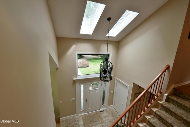 14 Friar Tuck Ct, Clifton Park, NY 12065 - foyer with high vaulted ceiling, a skylight, and stairs
