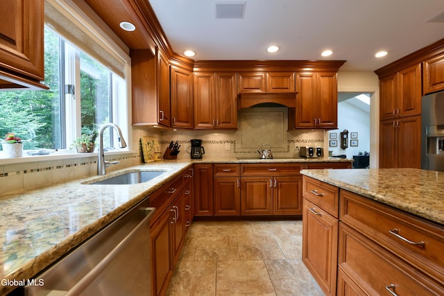 14 Friar Tuck Ct, Clifton Park, NY 12065 - kitchen with stainless steel appliances, backsplash, recessed lighting, light stone counters, and brown cabinetry