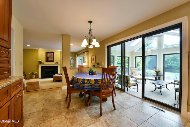 14 Friar Tuck Ct, Clifton Park, NY 12065 - dining area with recessed lighting, a fireplace, and a chandelier