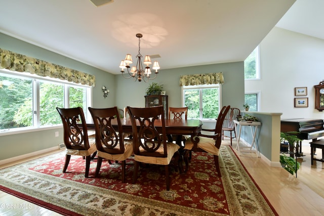 14 Friar Tuck Ct, Clifton Park, NY 12065 - dining area featuring plenty of natural light, light wood-style floors, and a chandelier