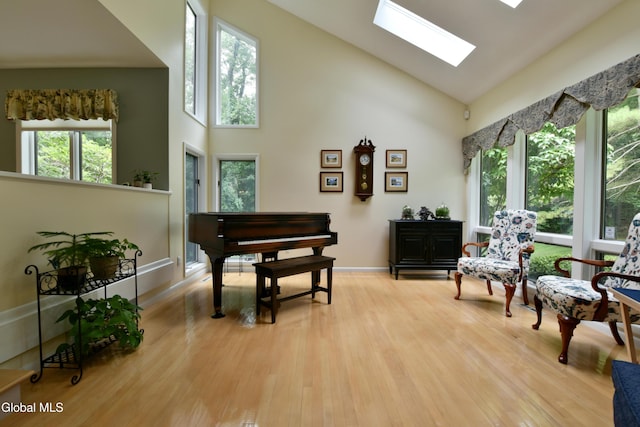 14 Friar Tuck Ct, Clifton Park, NY 12065 - living area featuring high vaulted ceiling, a skylight, and light wood-type flooring