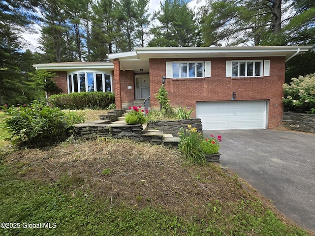 1718 Thacher Park Rd, Berne, NY 12059 - view of front facade with driveway, an attached garage, and brick siding