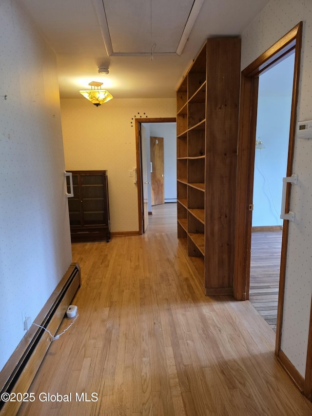 1718 Thacher Park Rd, Berne, NY 12059 - hall with a baseboard radiator, attic access, wallpapered walls, and light wood finished floors