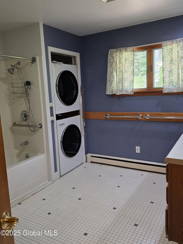 1718 Thacher Park Rd, Berne, NY 12059 - laundry area with estacked washer and dryer, a baseboard heating unit, and tile patterned floors