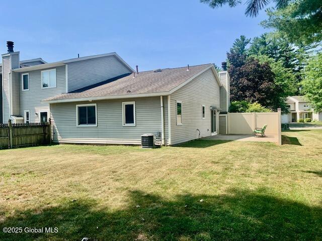 2059 Rosedale Way, Guilderland, NY 12303 - back of property with a chimney and a patio area