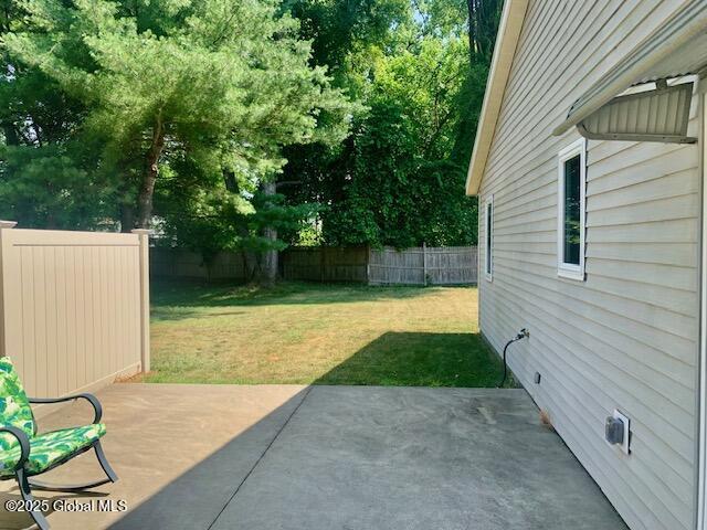 2059 Rosedale Way, Guilderland, NY 12303 - fenced backyard featuring a patio area