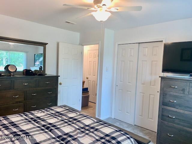 2059 Rosedale Way, Guilderland, NY 12303 - bedroom with a closet and a ceiling fan