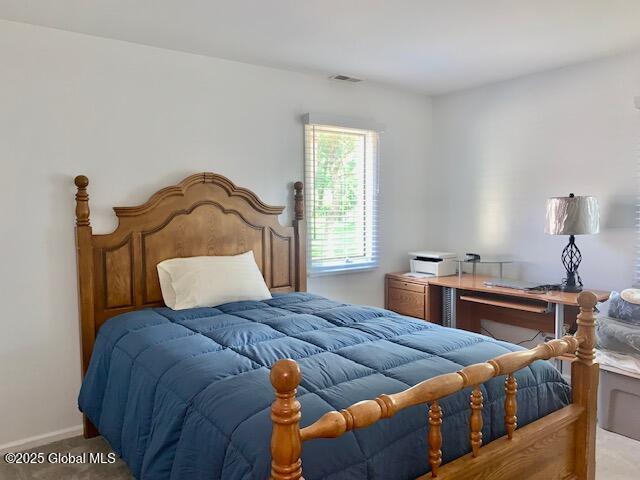 2059 Rosedale Way, Guilderland, NY 12303 - carpeted bedroom featuring baseboards