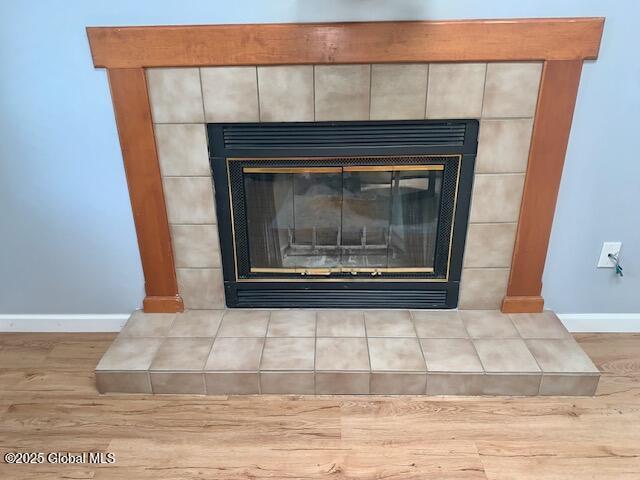 2059 Rosedale Way, Guilderland, NY 12303 - detailed view of a tile fireplace and wood finished floors