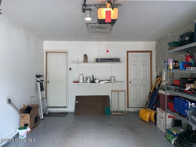 2059 Rosedale Way, Guilderland, NY 12303 - garage featuring a garage door opener