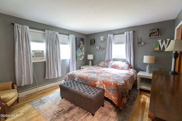 7 Shady Gln, Clifton Park, NY 12019 - bedroom featuring a baseboard heating unit, wood finished floors, and cooling unit