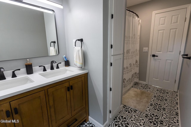 7 Shady Gln, Clifton Park, NY 12019 - full bath featuring double vanity, tile patterned flooring, and a shower with shower curtain