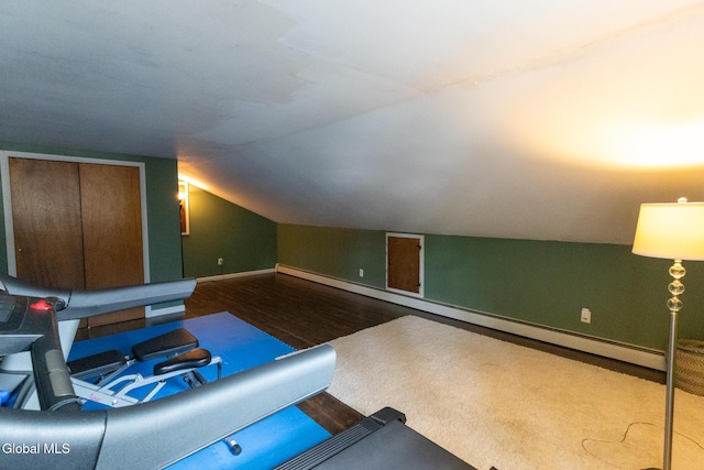 7 Shady Gln, Clifton Park, NY 12019 - exercise room with baseboard heating, vaulted ceiling, and wood finished floors