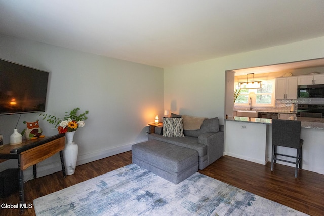 7 Shady Gln, Clifton Park, NY 12019 - living area with dark wood finished floors and a chandelier
