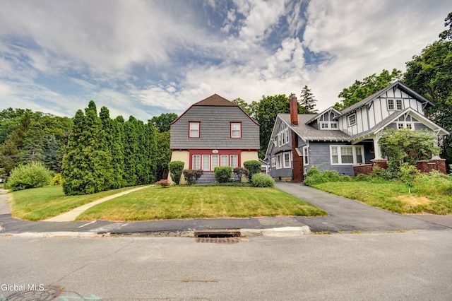 1151 Oxford Pl, Schenectady, NY 12308 - view of front of property featuring a chimney and a front yard